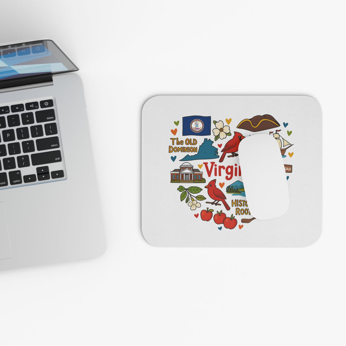 Virginia themed mousepad with illustrations and text, next to a laptop.