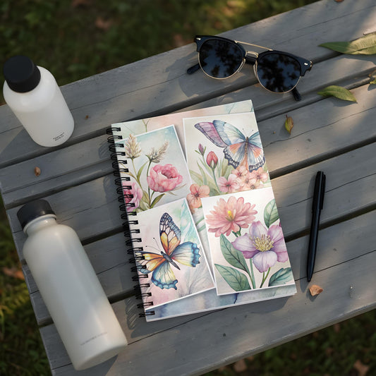 Spiral-bound notebook with watercolor butterflies and floral illustrations.