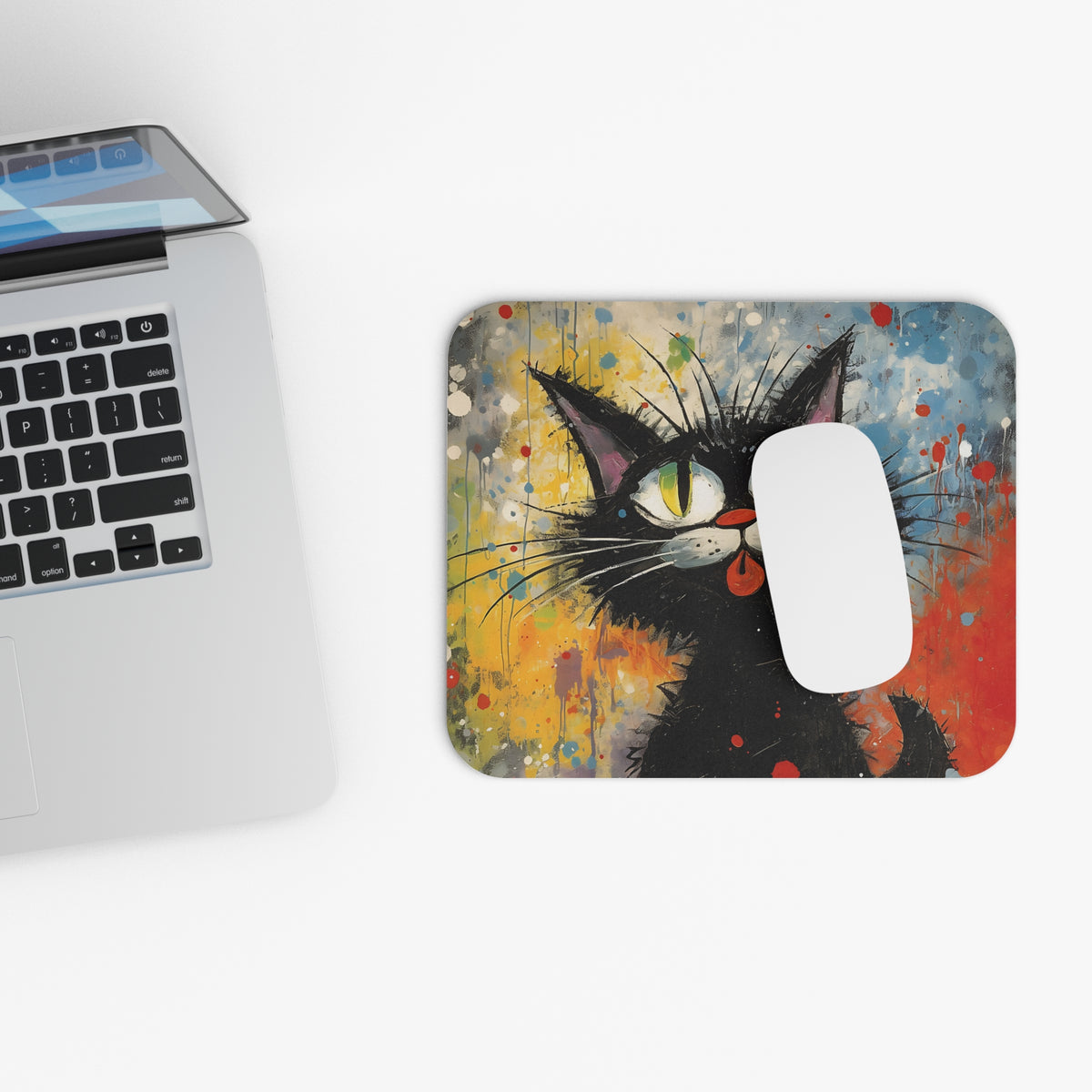 Abstract mousepad with black cat art and a white computer mouse.