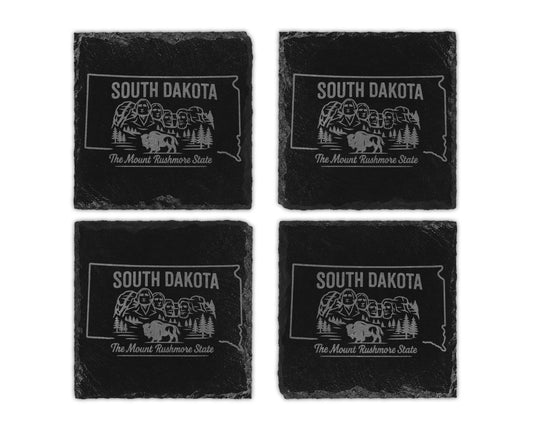 Four South Dakota slate coasters etched with Mount Rushmore and buffalo graphic.