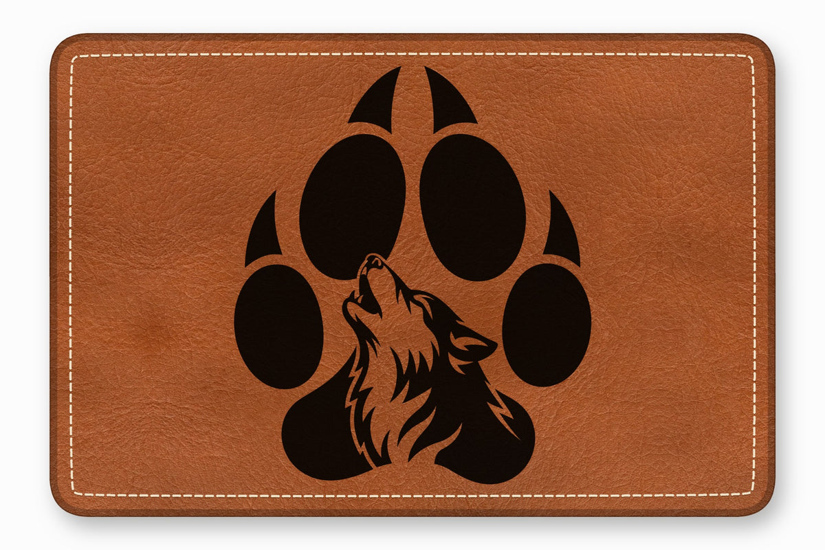 Brown leather patch featuring a black paw print graphic with a howling wolf silhouette.