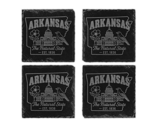 Four slate coasters each engraved with "Arkansas The Natural State Est. 1836".