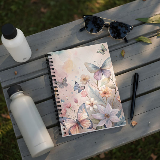 Spiral notebook with a watercolor floral and butterfly design.