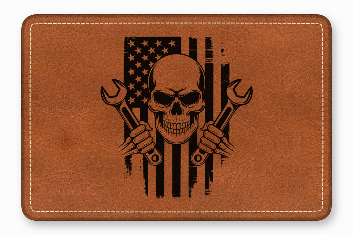 Brown faux leather patch featuring a distressed American flag, skull, and crossed wrenches graphic with white border stitching.