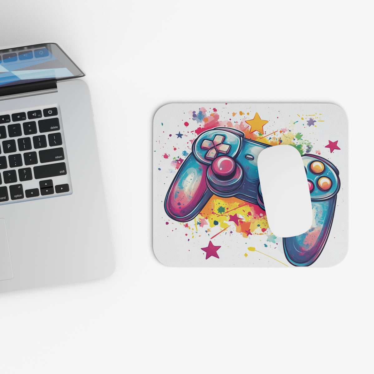 Watercolor gamepad and stars design on a rounded corner mousepad.