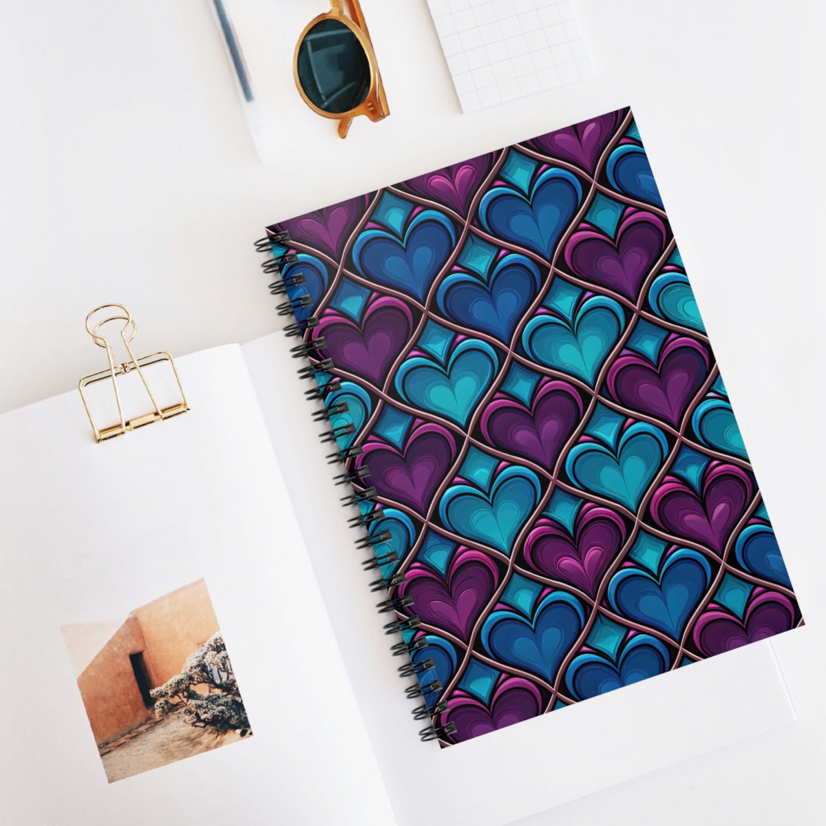 Spiral notebook with a stained glass heart pattern in purple and blue.