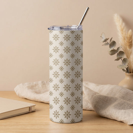 Tall tumbler with beige background and repeating golden snowflake pattern.