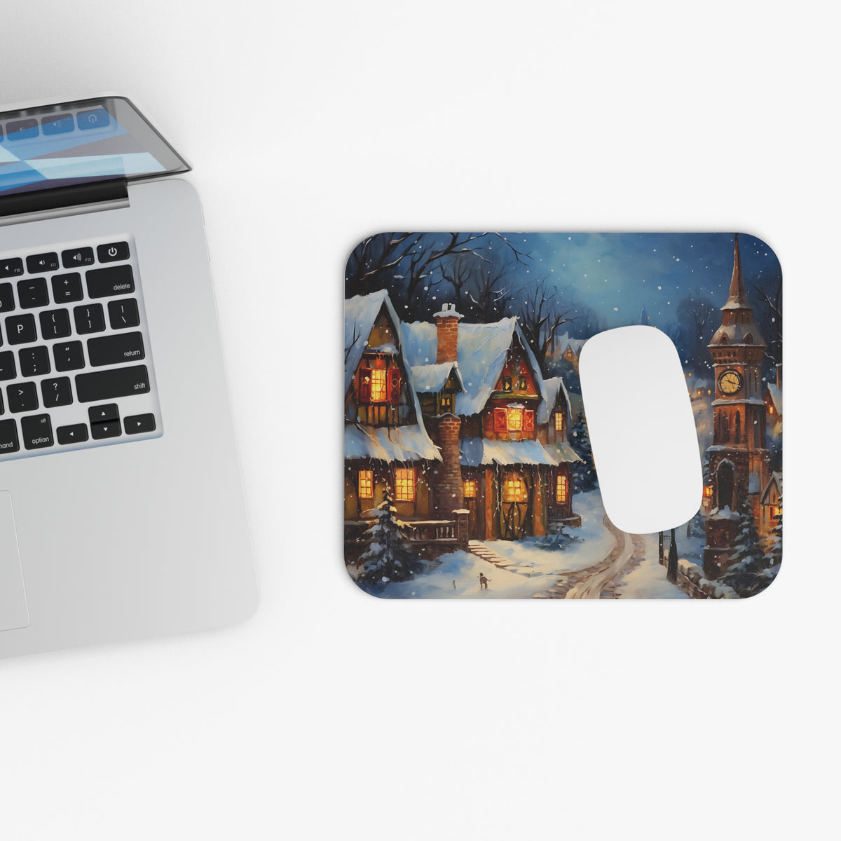 Mousepad featuring a snowy village scene with cozy illuminated houses and a clock tower.