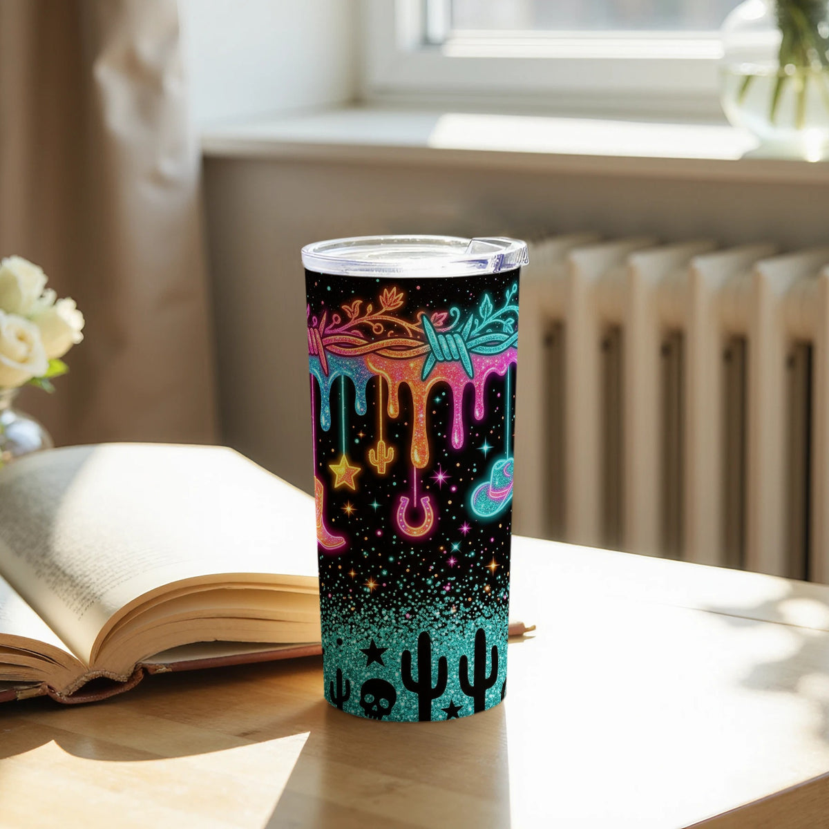 Tumbler with dripping barbed wire, cowboy boots, cactus, skull, hat, and horseshoe designs.