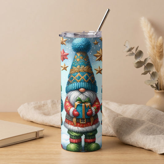 Tumbler with a Christmas gnome holding a gift, surrounded by stars and snowflakes.