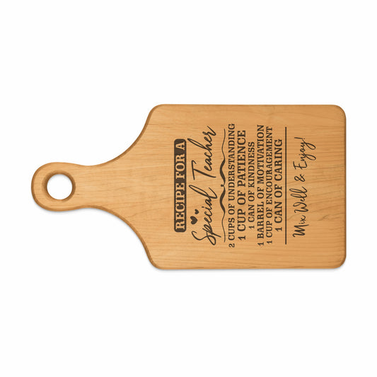 Wooden cutting board with engraved "Recipe for a Special Teacher" text and ingredients.
