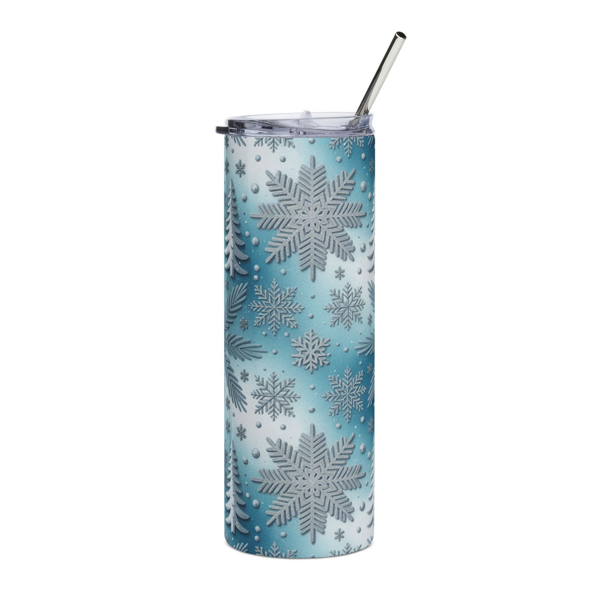 Tumbler with blue and white snowflake and pine tree pattern, and metal straw.
