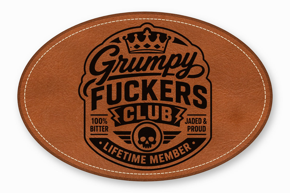 Oval brown leather patch with white stitched border, featuring a black engraved emblem and text.