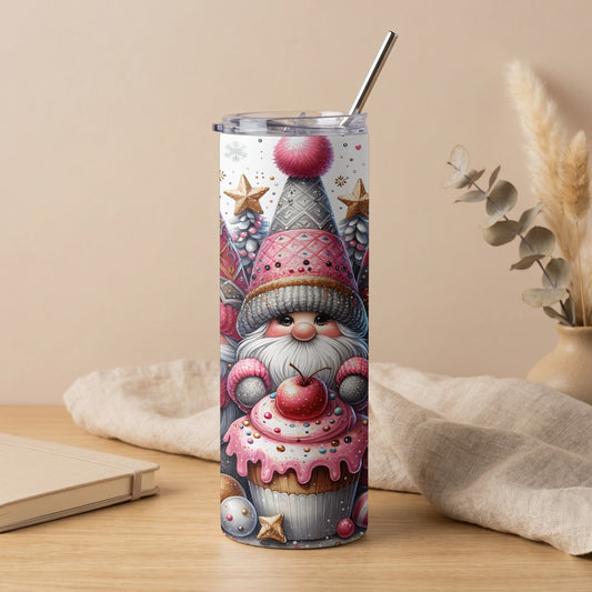 Gnome holding a cupcake on a tumbler with a metal straw.