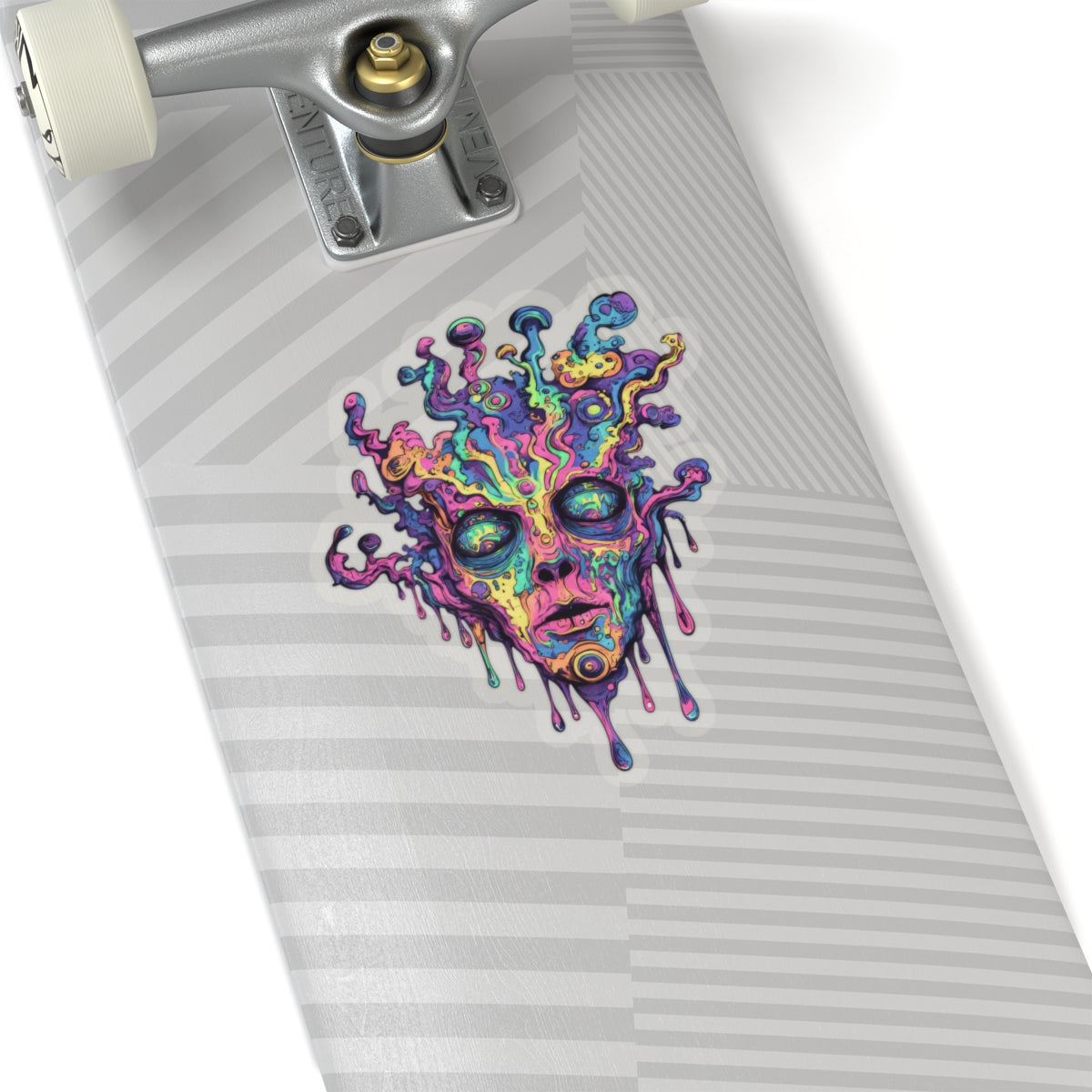 Colorful psychedelic melting face sticker on a skateboard deck.
