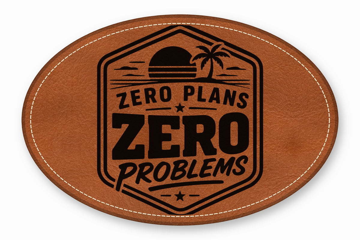 Oval brown leather patch with white stitched border, featuring a black tropical sunset emblem and the text Zero Plans Zero Problems.
