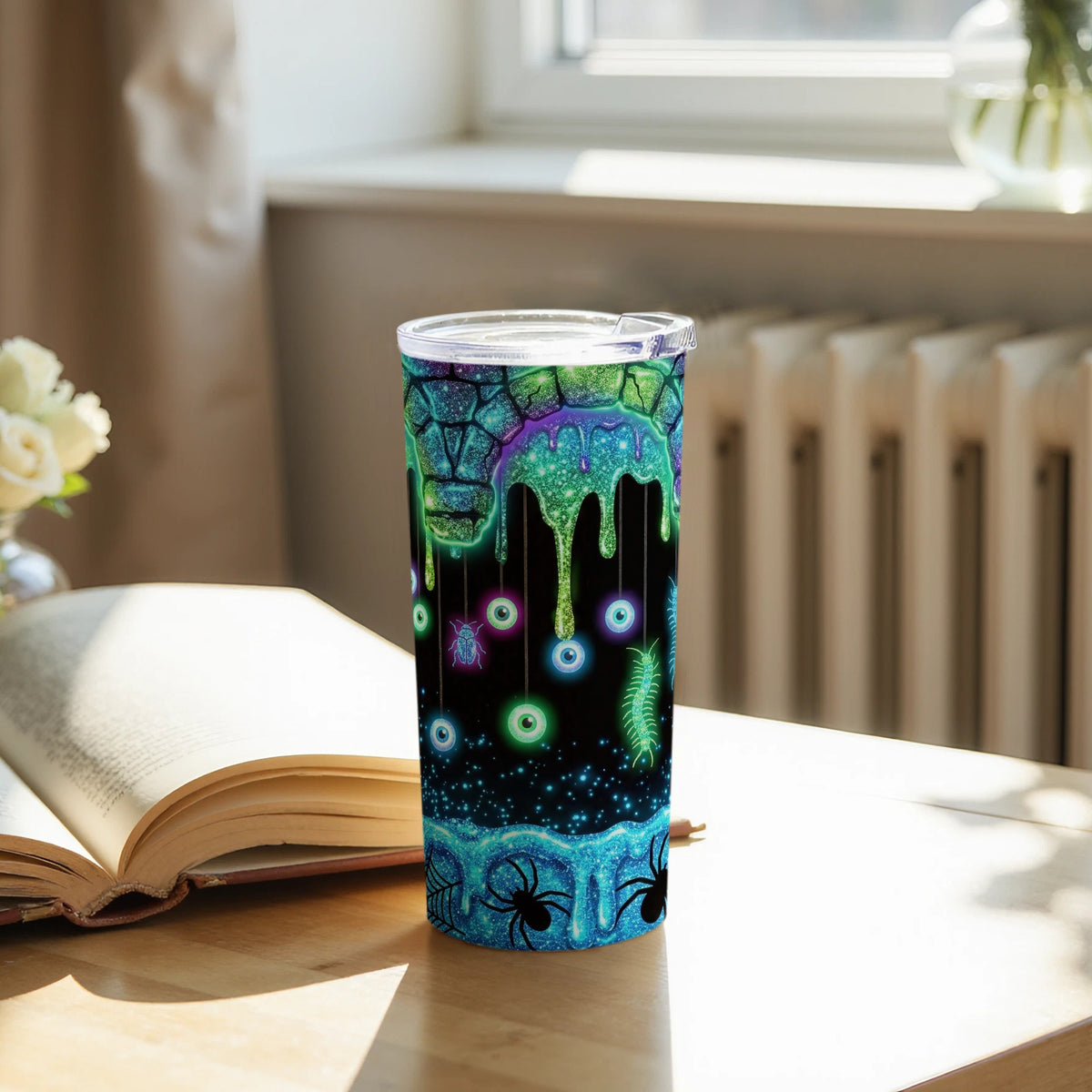 Tumbler with Halloween-themed design of dripping slime, eyeballs, spiders, and bugs.