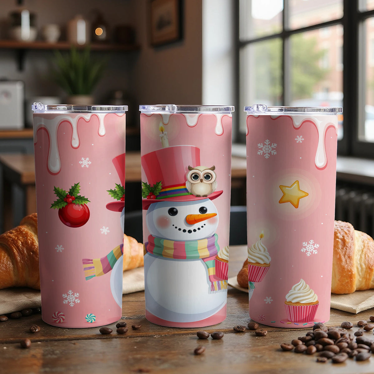 Three pink tumblers with Christmas snowman, holly, star, and cupcake designs.