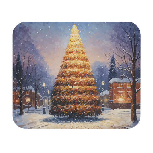 A lit Christmas tree stands on a snowy street with houses and trees.