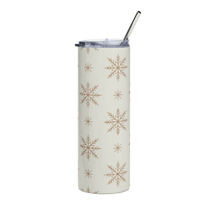 Tall tumbler with snowflake pattern and metal straw.