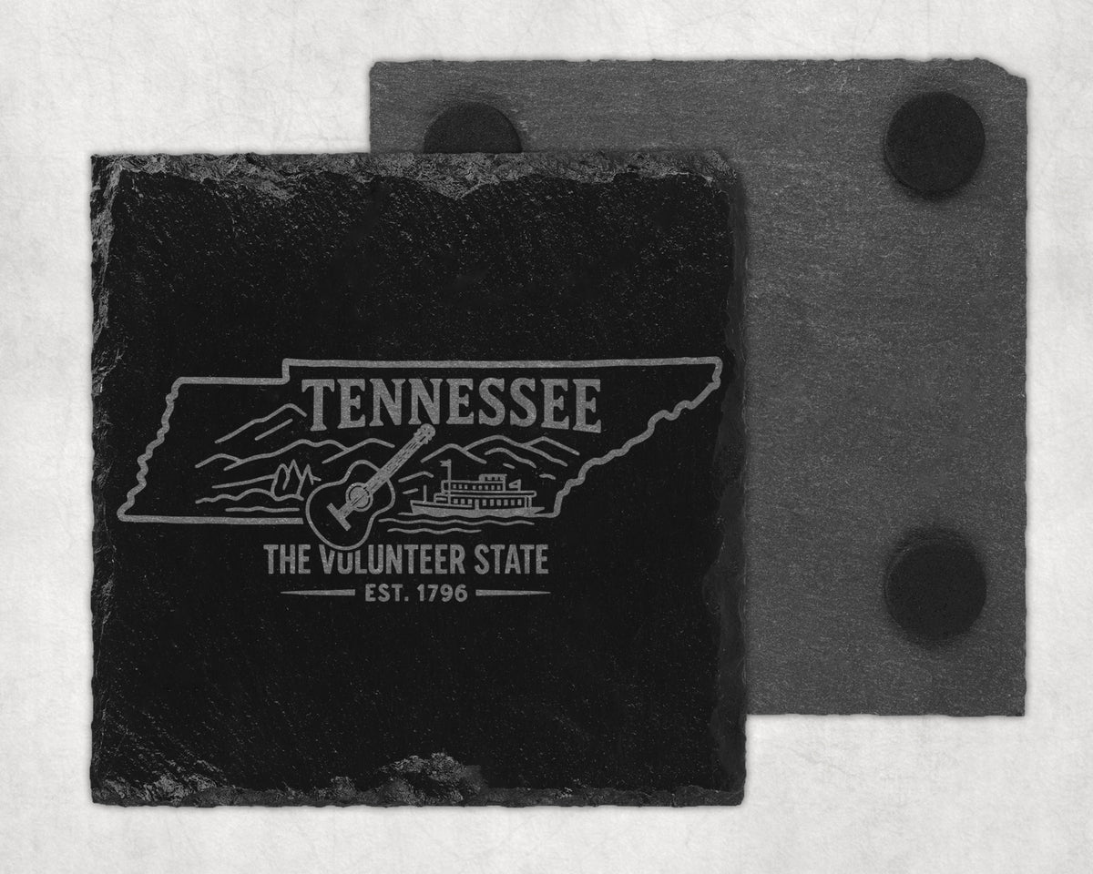 Tennessee slate coaster engraved with state outline, guitar, and steamboat.