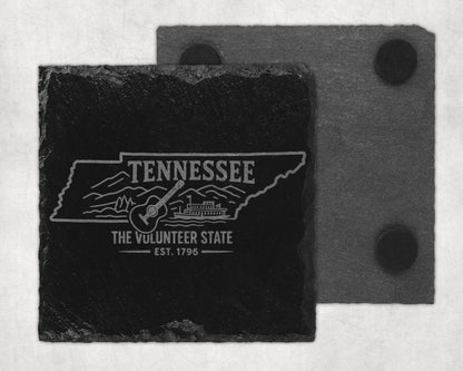 Tennessee slate coaster engraved with state outline, guitar, and steamboat.