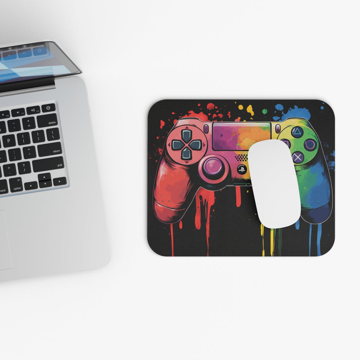 Mousepad with colorful dripping paint splatter gamepad graphic.