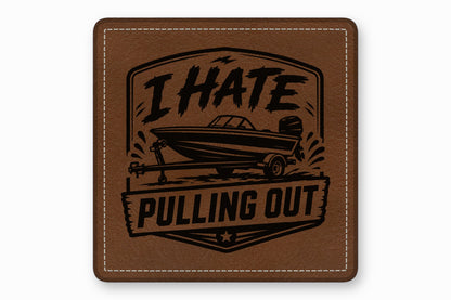 Brown square leather patch with white stitched border, featuring a boat graphic and text that reads I HATE PULLING OUT.