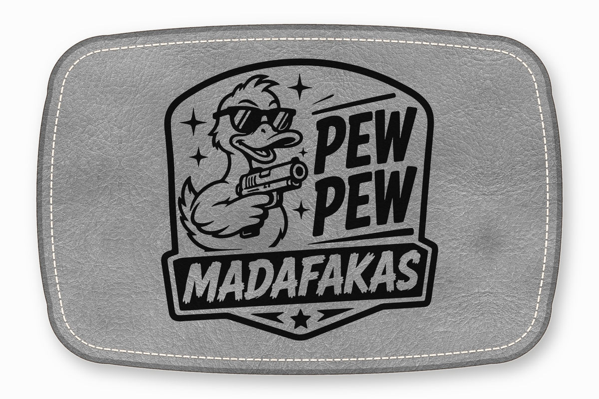 Grey rectangular leather patch with white stitched border and a black graphic of a duck holding a gun with the text PEW PEW MADAFAKAS.