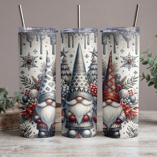 Three tumblers featuring gnomes with festive winter designs and metallic glitter accents.