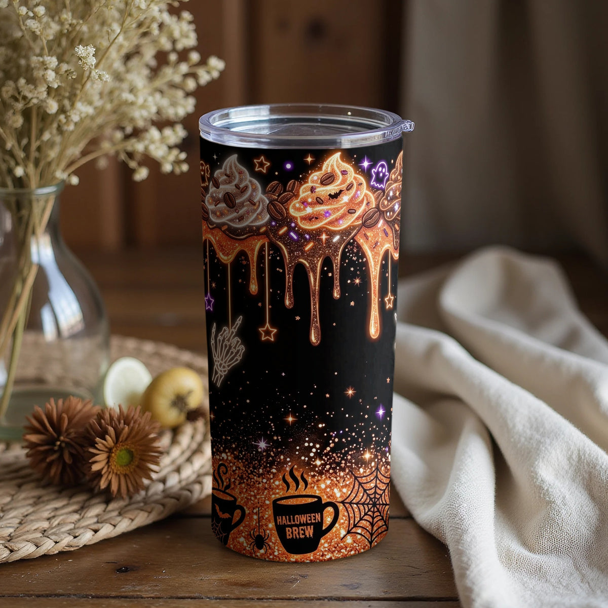 Halloween themed tumbler with coffee, ghosts, and spooky details.