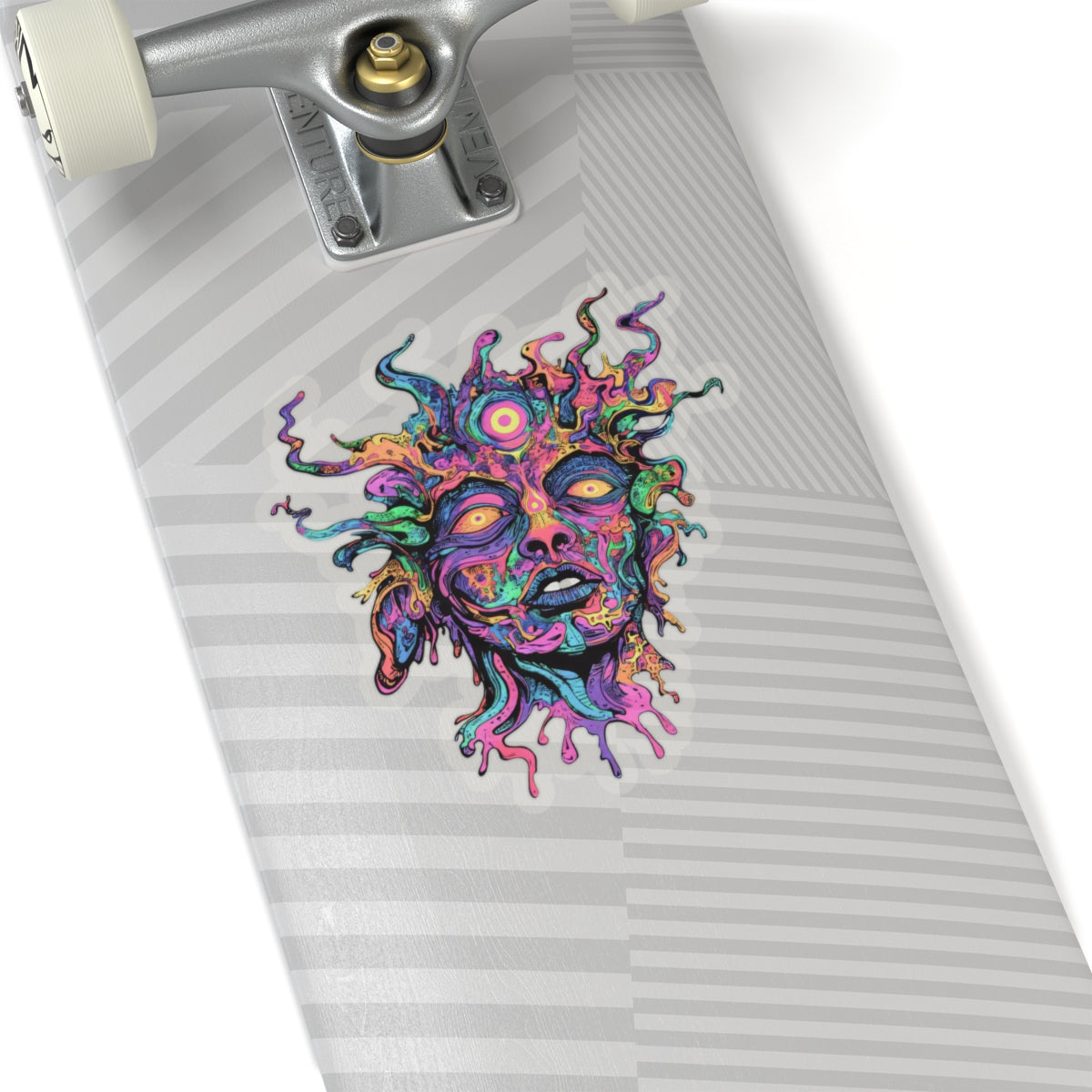 Vibrant, abstract face sticker with flowing lines and multiple eyes on a grey striped surface.
