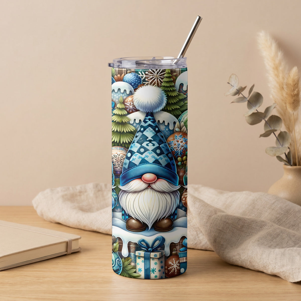Tall tumbler with blue and white Christmas gnome, trees, and ornaments design.