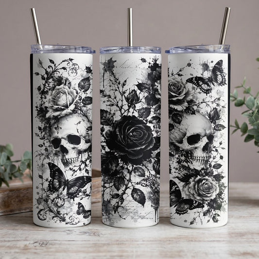 Three tumblers with black and white skull, rose, and butterfly designs.