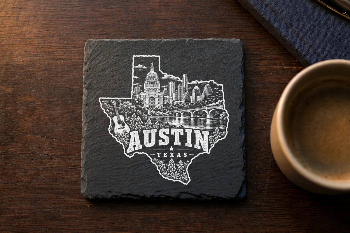 A square black slate coaster features a white etched Texas silhouette containing the Austin skyline.