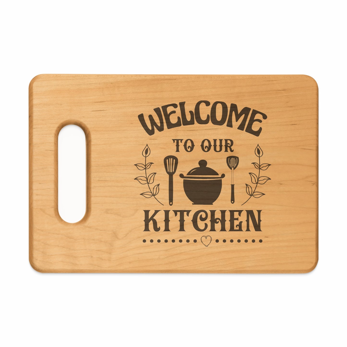Wooden cutting board with "Welcome To Our Kitchen" text and kitchen utensils.