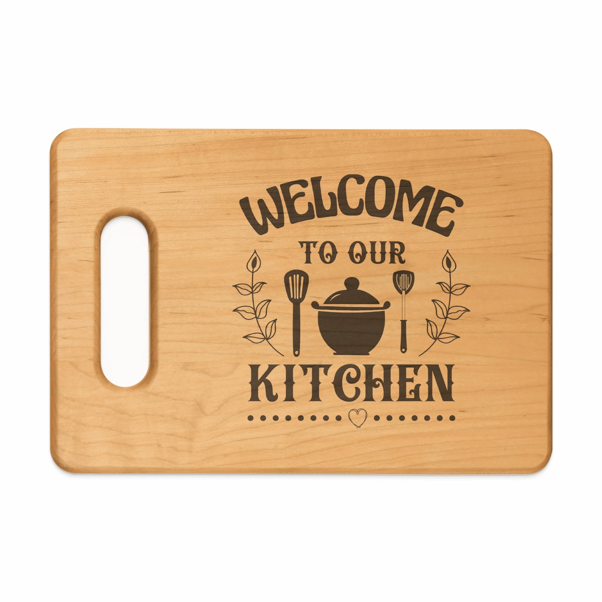 Wooden cutting board with "Welcome To Our Kitchen" text and kitchen utensils.