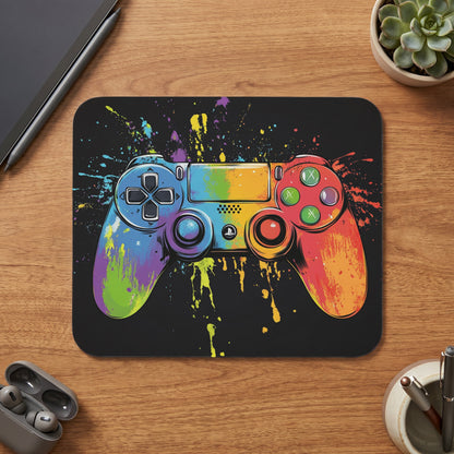 Gaming controller with rainbow paint splatters on a black background.