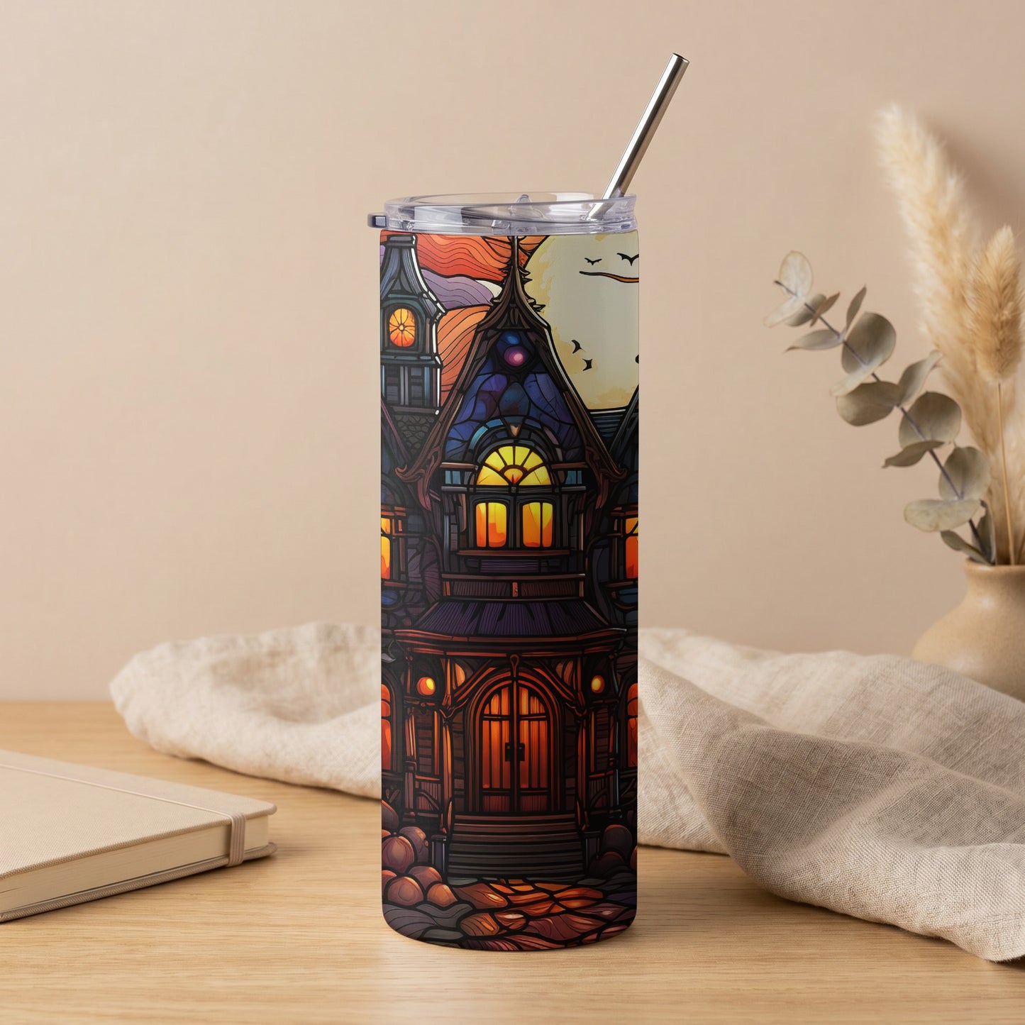 Tumbler with stained glass haunted house design and metal straw.