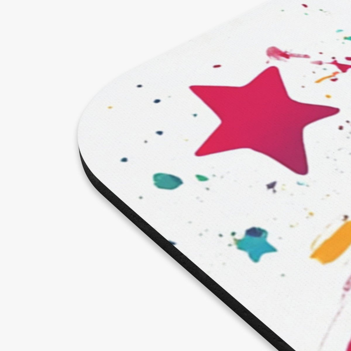 Mousepad with a white background featuring colorful paint splatters and stars.