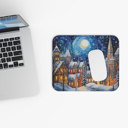 Mousepad with a winter village scene under a starry night sky.