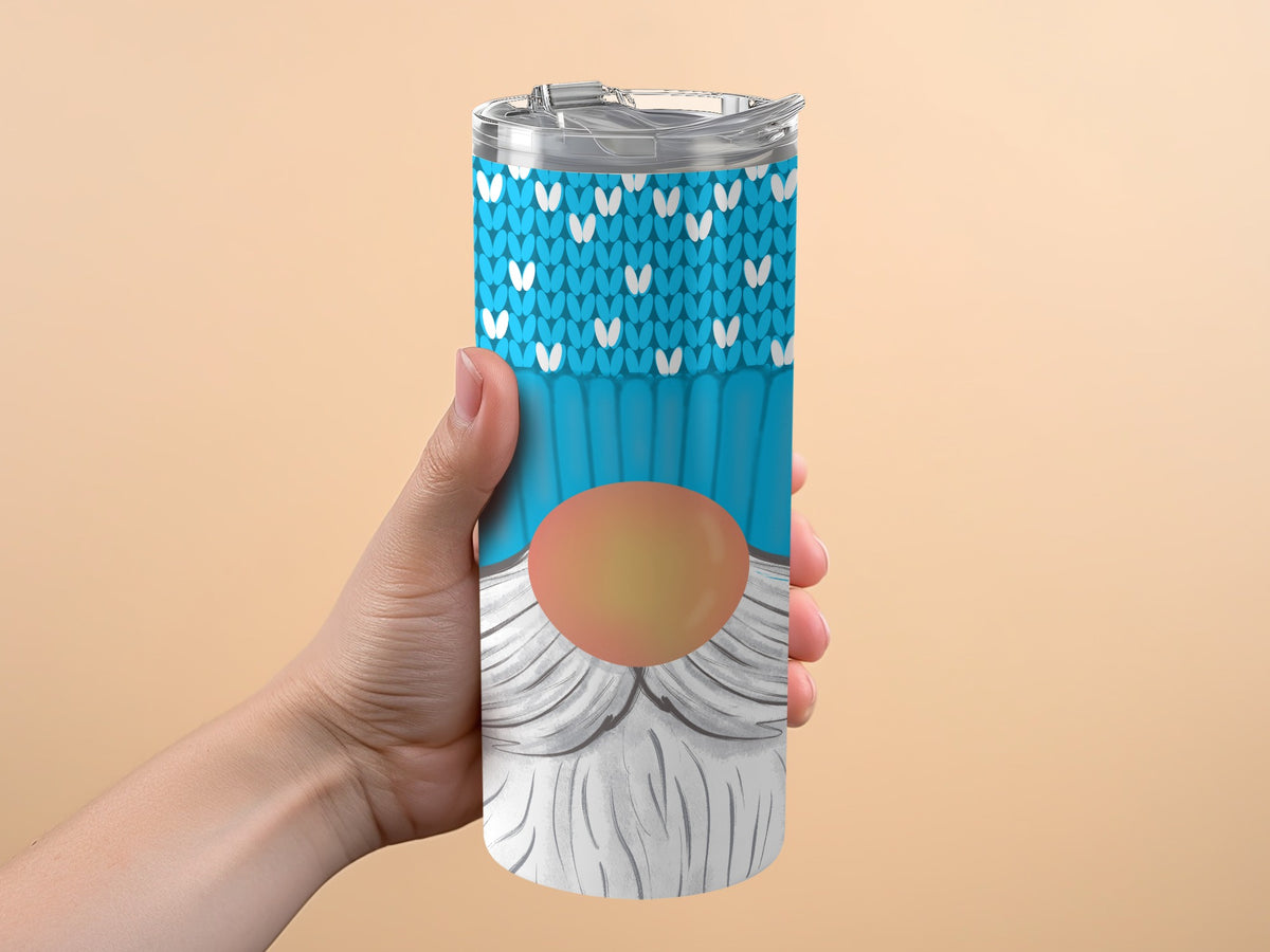 Tumbler with a blue knit pattern, a gnome nose, and white beard.