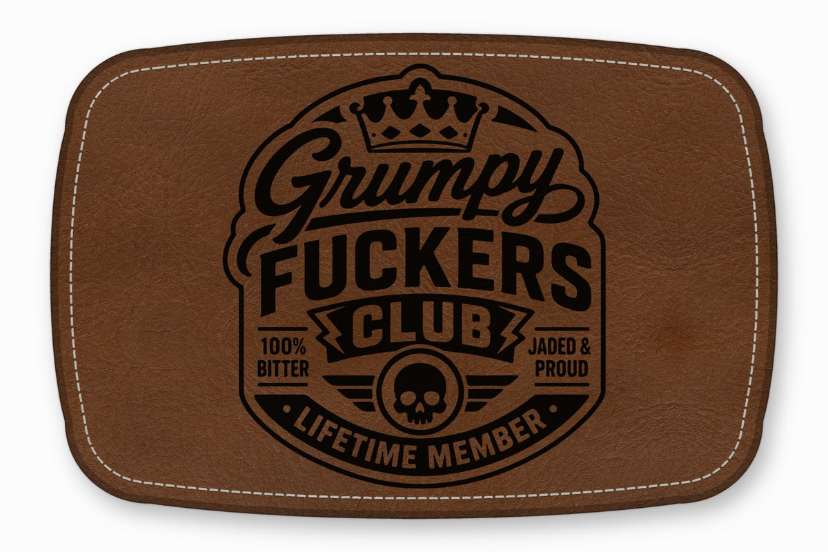 Brown faux leather patch with white stitched border and a black Grumpy Fuckers Club logo.