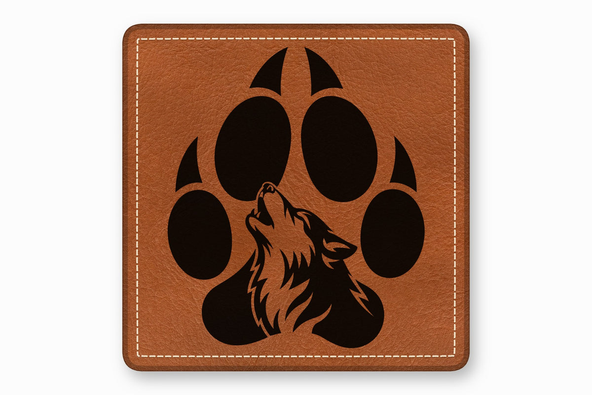 Square brown leather patch with white stitched border and a black wolf howling graphic inside a paw print.