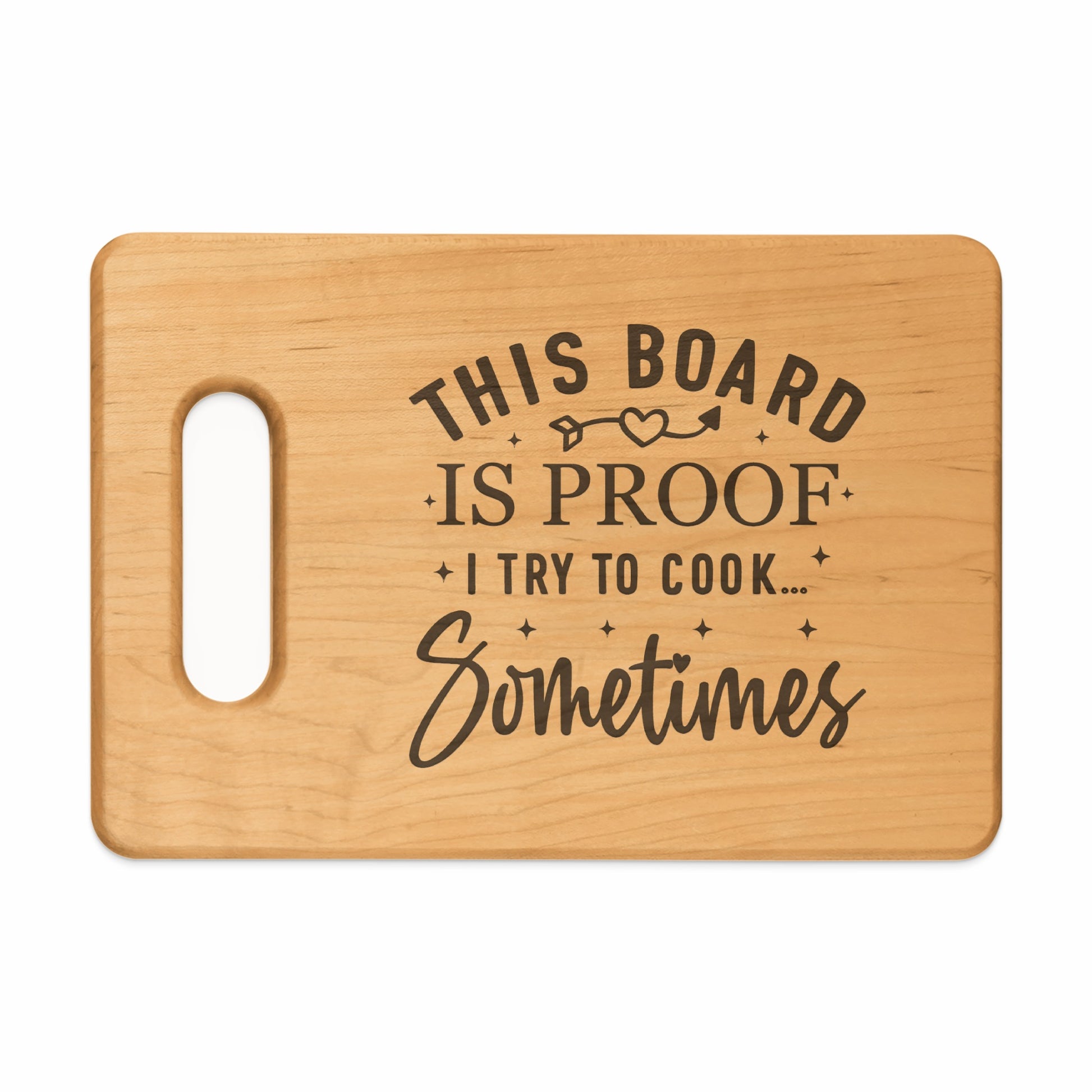Wooden cutting board with text "This board is proof I try to cook... Sometimes".