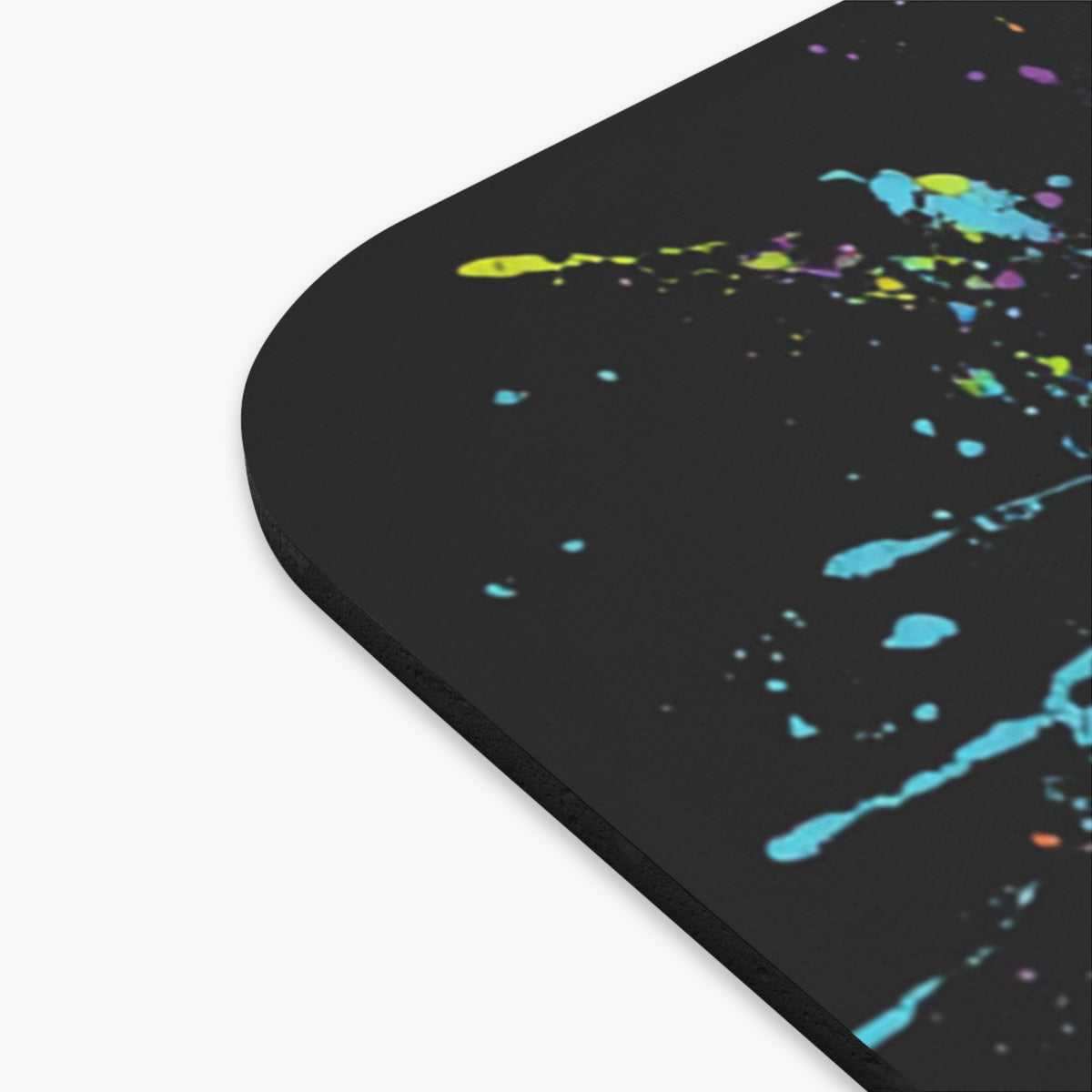 Black mousepad with colorful paint splatters.