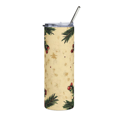 Tall tumbler with Christmas holly berry and snowflake pattern and metal straw.