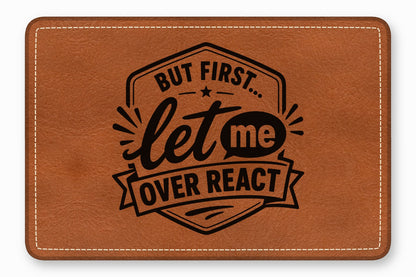 Brown leather patch featuring the engraved black text But first let me overreact inside a badge design.