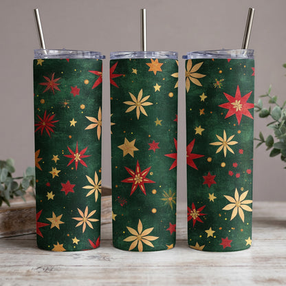 Three tumblers with a festive green background and a pattern of red and gold stars and flowers.