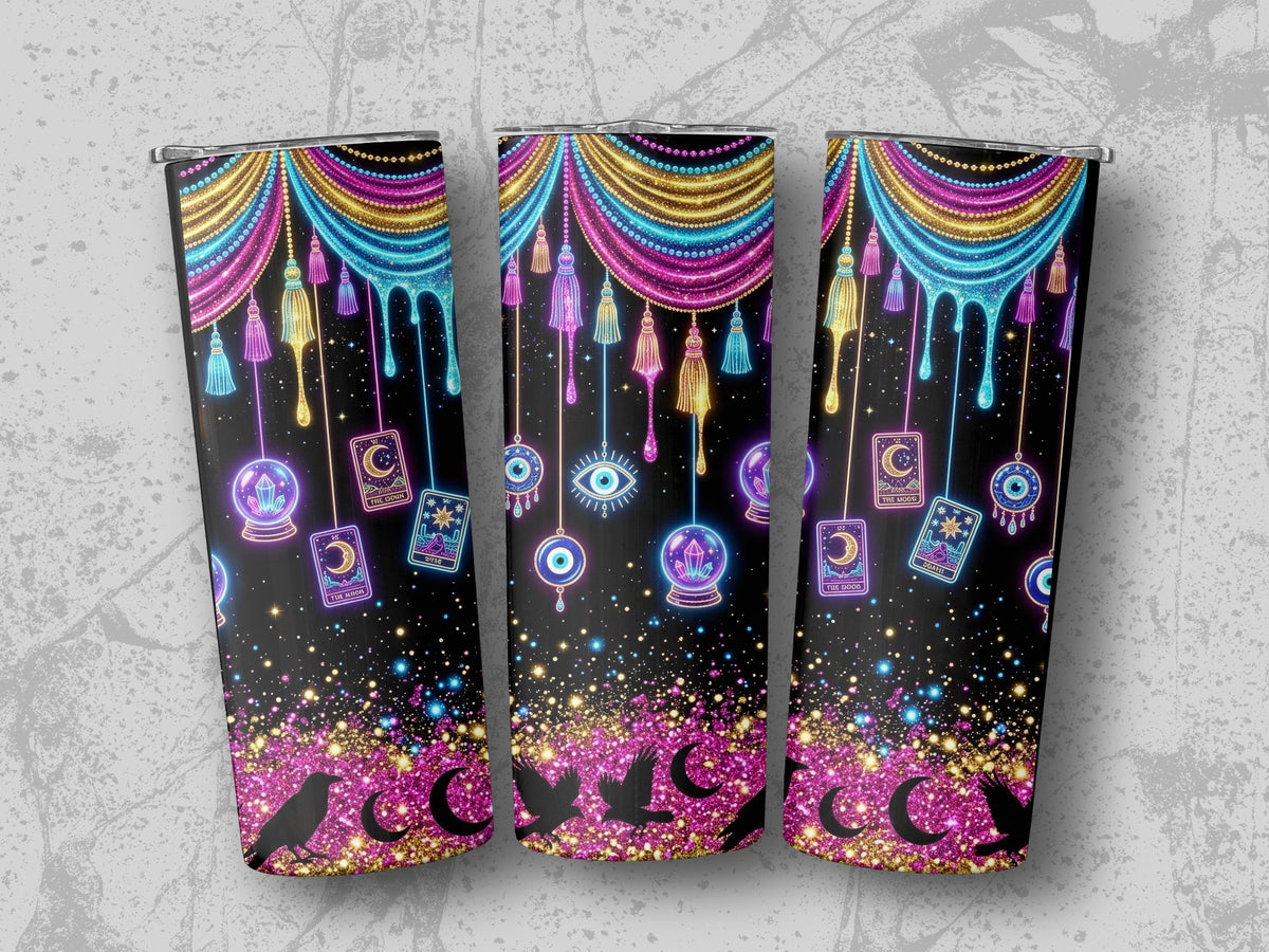 Black tumbler with cosmic, tarot, and evil eye designs, glitter, and tassels.